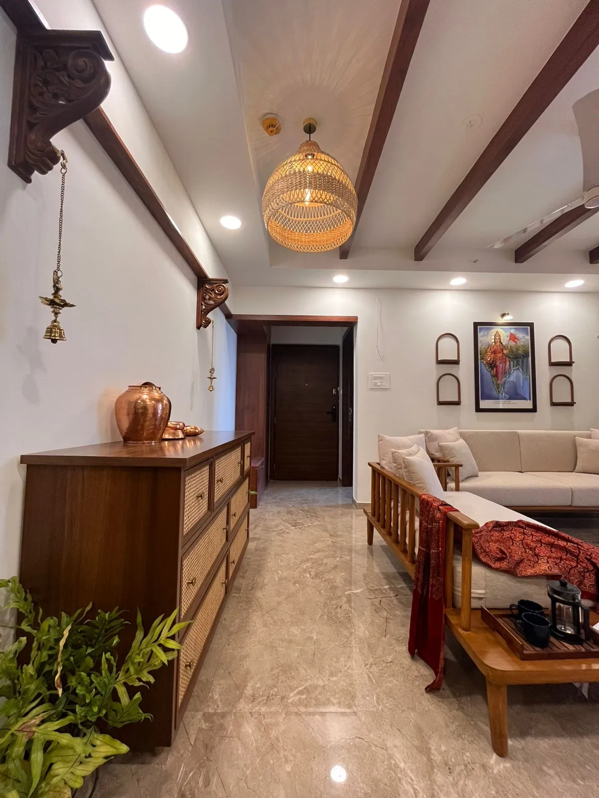 Restored veranda of the Prabhat Road bungalow with original Burma teak columns and terrazzo flooring
