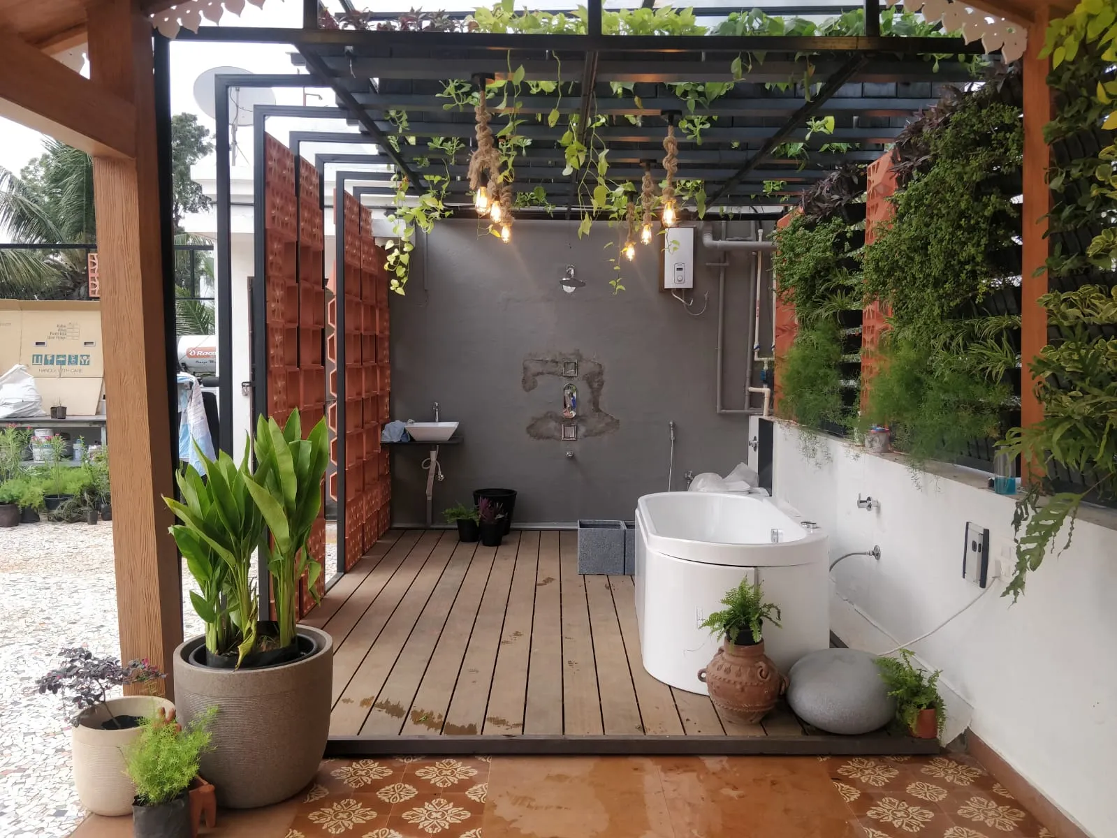 Rooftop terrace garden with pergola, planters and city skyline beyond