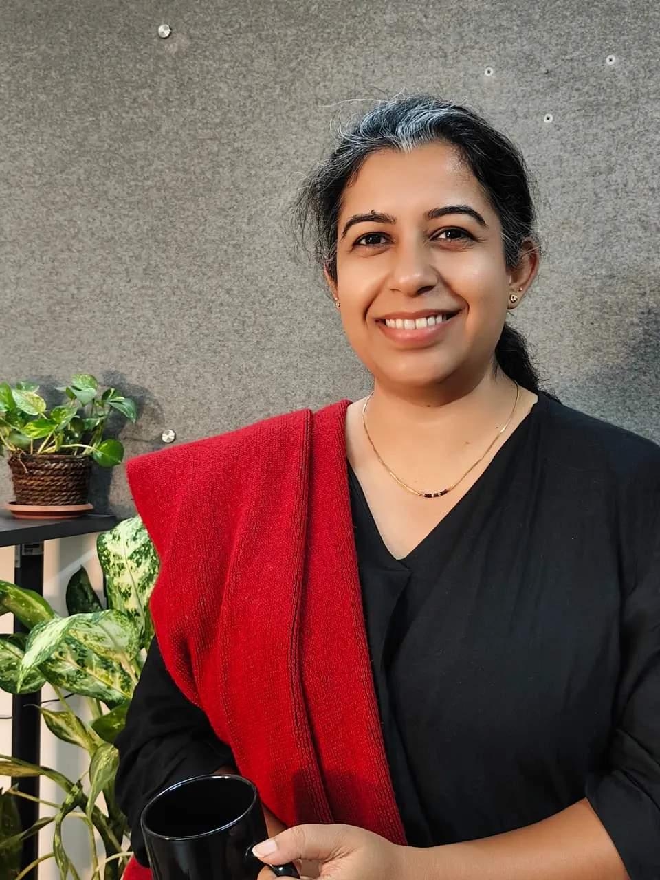 Portrait of Neha leading project delivery